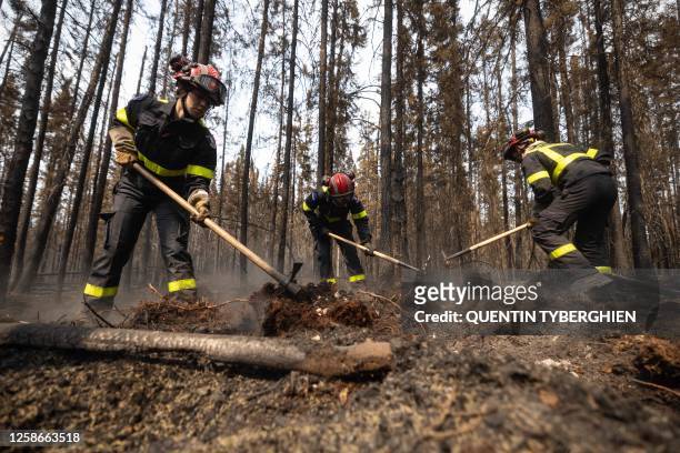 French firefighters battle fires north from the city of Chibugamau, Quebec, in Canada on June 12, 2023. Quebec has deployed hundreds of firefighters,...