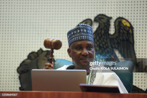 Nigeria's Speaker of House of Representative, Tajudeen Abass holds a gavel after emerging as the Speaker of the 10th Nigeria National Assembly in...