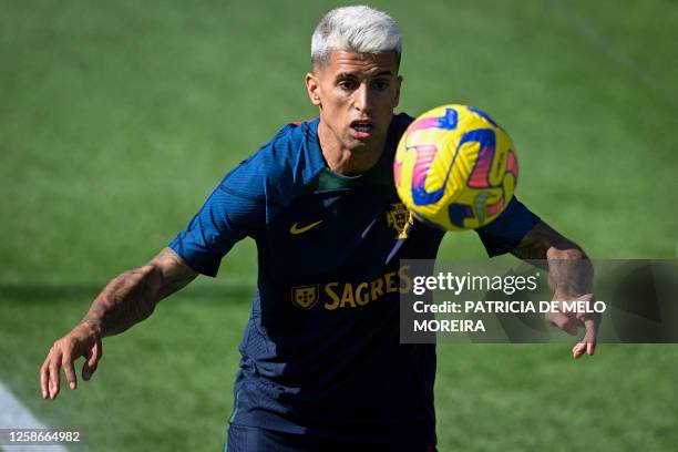 Portugal's defender Joao Cancelo attends a training session at Cidade do Futebol in Oeiras, outskirts of Lisbon on June 13, 2023 ahead of their UEFA...