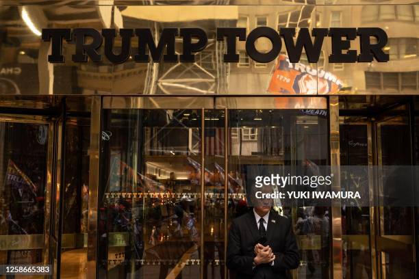 Security guard stands outside of Trump Tower in New York City on June 13, 2023. Former US President and 2024 Presidential hopeful Donald Trump is...