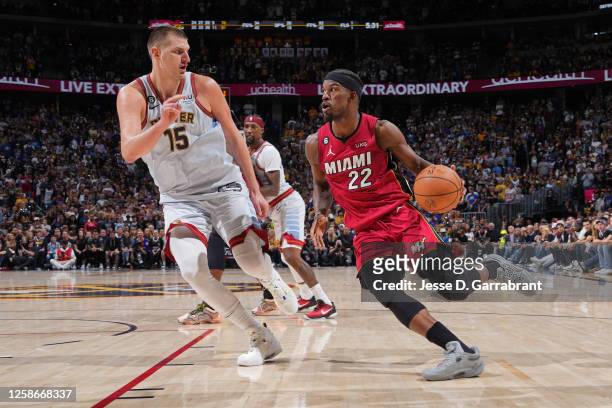 Nikola Jokic of the Denver Nuggets plays defense against Jimmy Butler of the Miami Heat during Game Five of the 2023 NBA Finals on June 12, 2023 at...