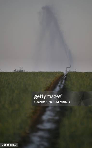 Aerial drone picture shows the watering of a field in Hellecine, Tuesday 13 June 2023. BELGA PHOTO ERIC LALMAND