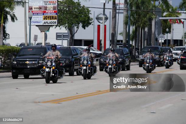 The motorcade carrying former U.S. President Donald Trump is seen outside the Cuban restaurant Versailles after he appeared for his arraignment on...