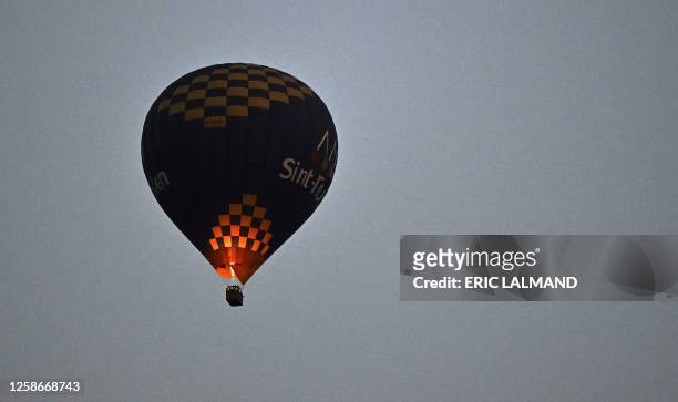 Aerial drone picture shows a hot-air balloon in the air in Hellecine, Tuesday 13 June 2023. BELGA PHOTO ERIC LALMAND