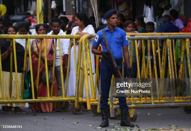 Sri Lankan soldier stands guard outside St. Anthony's Shrine during the 189th annual feast of St. Anthony's Church in Kochchikade, Colombo on June...