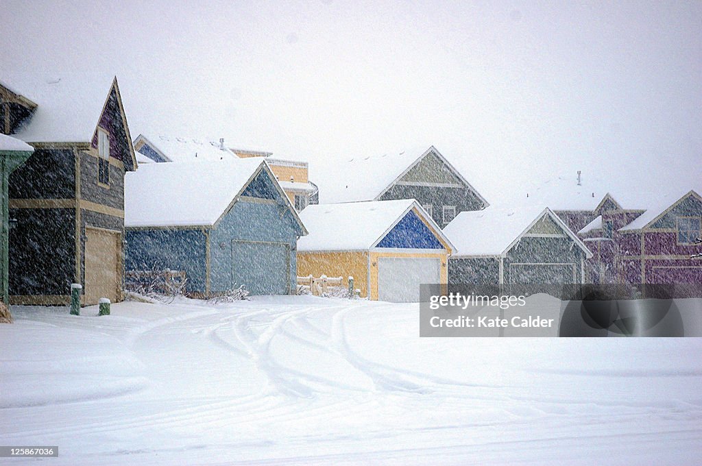 View of colorful houses in middle of snow storm