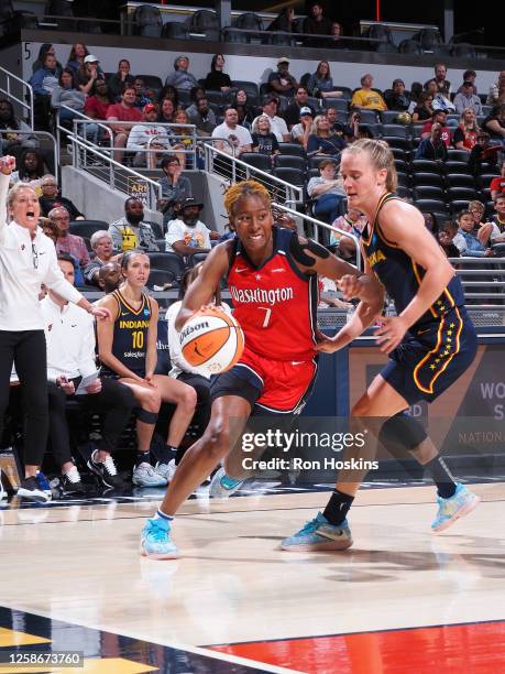 Ariel Atkins of the Washington Mystics drives to the basket during the game against the Indiana Fever on June 13, 2023 at Gainbridge Fieldhouse in...