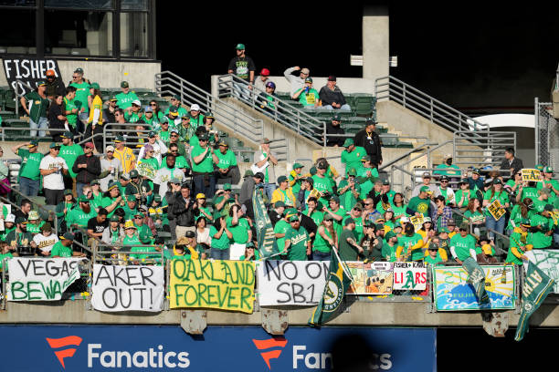 Oakland Athletics fans display signs during a reverse boycott game against the Tampa Bay Rays at RingCentral Coliseum on June 13, 2023 in Oakland,...