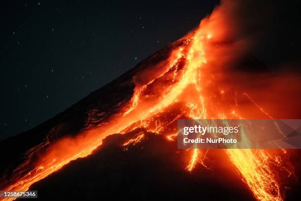 Lava and ashes flow from the Mayon Volcano which remains under alert level 3, as seen in Legazpi, Albay province, Philippines, on June 13, 2023.