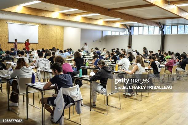 Pupils works on the philosophy test as part of the baccalaureat exams at the lycee Marie Louise Dissard Francoise, in Tournefeuille, southwestern...