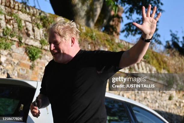 Former British Prime Minister Boris Johnson returns to his house after a run, in Brightwell-cum-Stowell, west of London on June 14, 2023.
