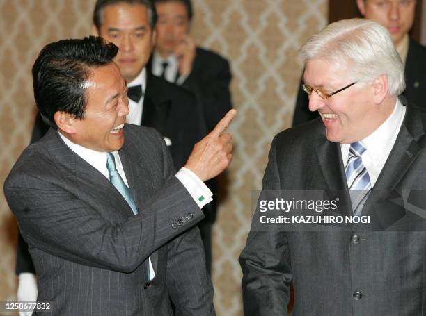 Visiting German Foreign Minister Frank-Walter Steinmeier and his Japanese counterpart Taro Aso share a laugh prior to their talks at the Foreign...