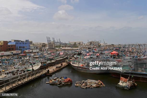 Fishing boats are moored at Karachi port as a part of precautionary measures before the due onset of cyclone, in Karachi on June 14, 2023. More than...