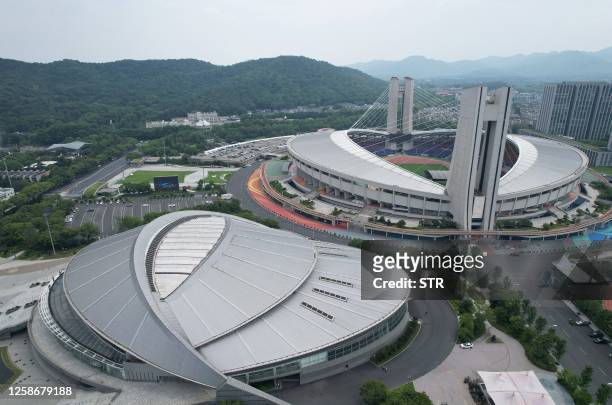 This aerial photo taken on June 14, 2023 shows the Yellow Dragon Sports Center Stadium and Gymnasium, venues of the 19th Asian Games, in Hangzhou in...