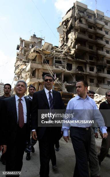 Pro-Hezbollah parlimanterian Hassan Fadlallah escorts Cypriot Foreign Minister George Lillikas during his visit to Beirut's southern suburb, 24...