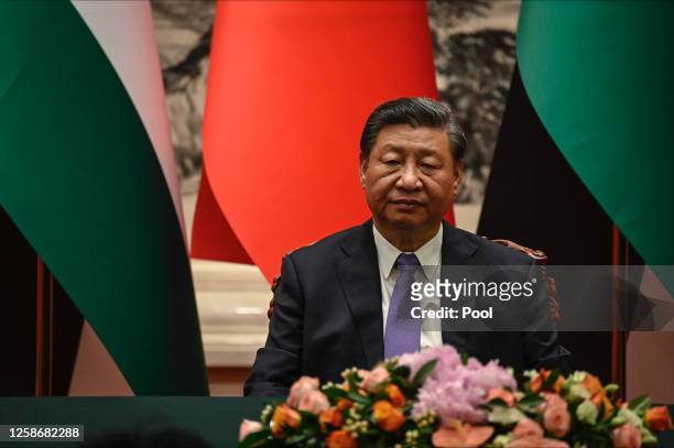 China's President Xi Jinping attends attends a signing ceremony with Palestinian President Mahmud Abbas at the Great Hall of the People in Beijing on...