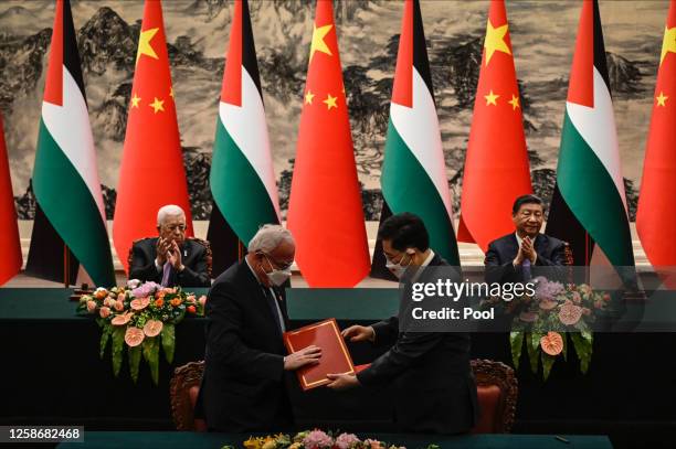 Palestinian Foreign Minister Riyad Al-Maliki attends a signing ceremony with Chinese Foreign Minister Qin Gang as Palestinian President Mahmoud Abbas...