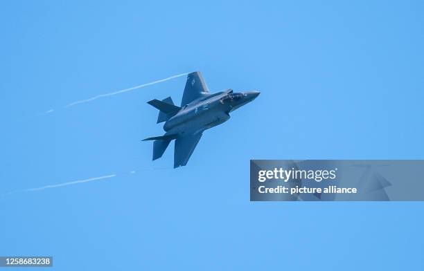 June 2023, Rhineland-Palatinate, Spangdahlem: An F-35 fighter aircraft flies over the U.S. Spangdahlem Air Base during the Air Defender 2023 air...