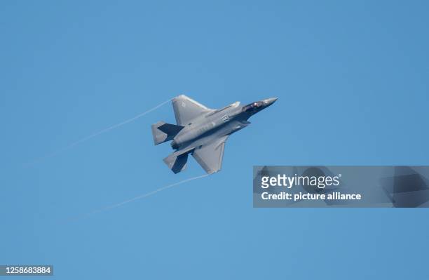June 2023, Rhineland-Palatinate, Spangdahlem: An F-35 fighter aircraft flies over the U.S. Spangdahlem Air Base during the Air Defender 2023 air...
