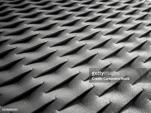 close-up perspective photo of a die cut and textured sheet metal - macro stock-fotos und bilder