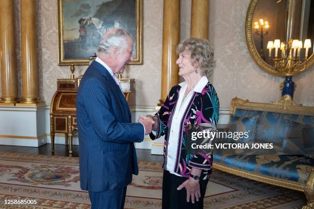 Britain's King Charles III receives Sue Leyden, daughter of expedition leader Lord Hunt, during an audience at Buckingham Palace, in London, on June...