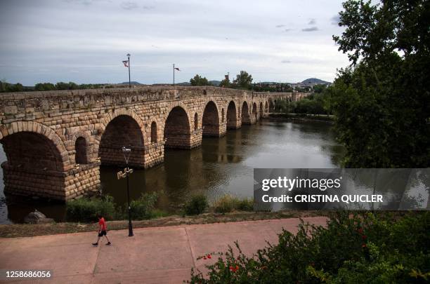 Picture shows the Roman Bridge over the Guadiana river in Merida on June 6, 2023. Merida is one of the 13 Spanish cities classified as World Heritage...