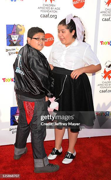 Rico Rodriguez and Raini Rodriguez arrive at the 17th Annual Dream Halloween CAAF Benefit at Barker Hangar on October 30, 2010 in Santa Monica,...