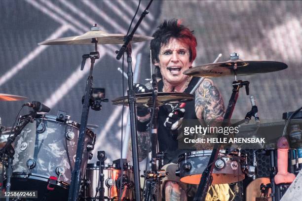 Drummer Tommy Lee of US band Mötley Crüe performs during the rock and metal festival Copenhell on Refshaleoeen in Copenhagen on June 14, 2023. /...