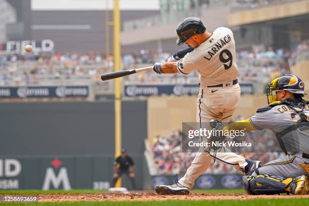 Trevor Larnach of the Minnesota Twins hits an RBI double against the Milwaukee Brewers during the third inning at Target Field on June 14, 2023 in...