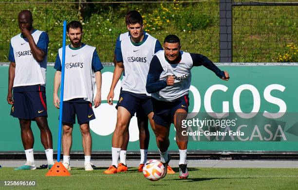 Cristiano Ronaldo of Portugal with teammates in action during the Portugal Training Session at Cidade do Futebol FPF on June 14, 2023 in Oeiras,...