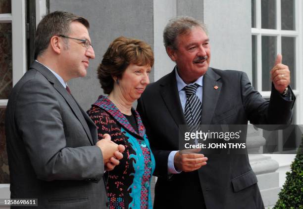 Belgian Foreign Minister Steven Vanackere and EU foreign policy chief Catherine Ashton welcome Luxembourg Foreign Minister Jean Asselborn prior to...
