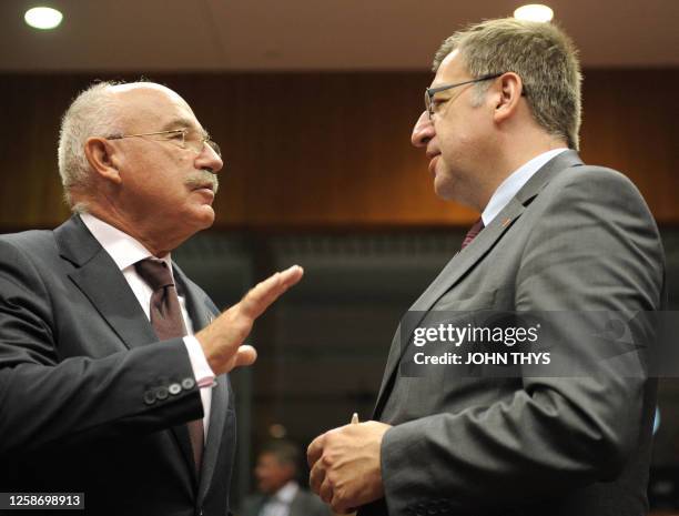 Belgian Foreign Minister Steven Vanackere speaks with Hungarian Foreign Affairs minister Janos Martonyi before a Trade ministers Council meeting on...