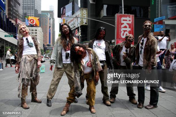 People participate in a zombie walk promoting the release of TV show "The Walking Dead: Dead City" in Times Square, New York, June 14, 2023.