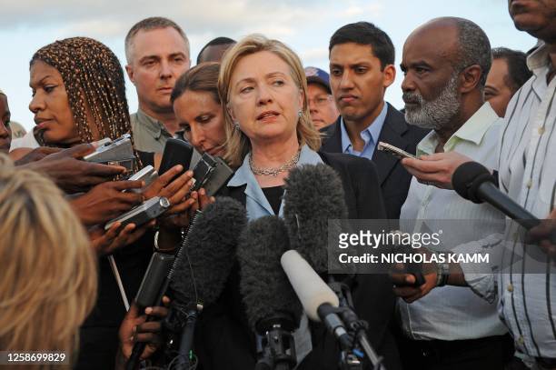 Secretary of State Hillary Clinton speaks to the press with Haitian President Rene Preval after their meeting at Port-au-Prince's Toussaint...