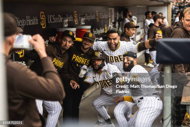 Fernando Tatis Jr. #23 of the San Diego Padres celebrates in the dugout after hitting a home run in the first inning against the Cleveland Guardians...