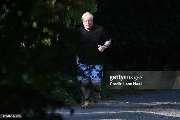 Former British Prime Minister Boris Johnson is seen on his morning run on June 15, 2023 in Brightwell-cum-Sotwell, England. The Privileges Committee...