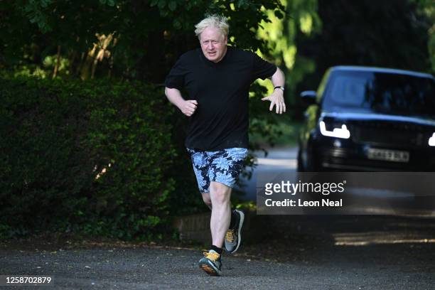 Former British Prime Minister Boris Johnson is seen on his morning run on June 15, 2023 in Brightwell-cum-Sotwell, England. The Privileges Committee...