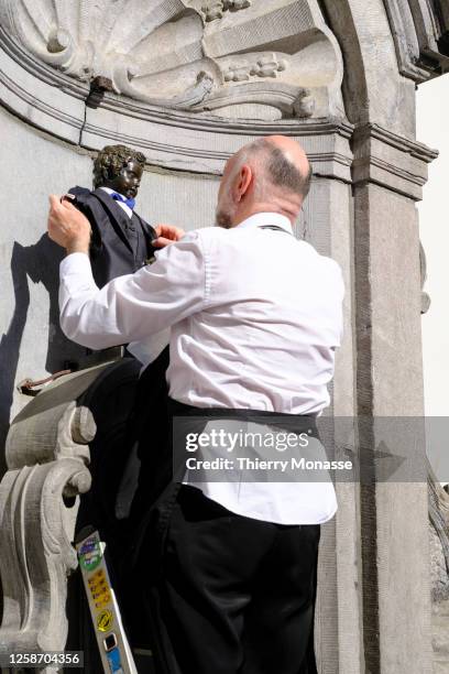 The Manneken Pis dressed as Charles Rogier is undressed on June 14, 2023 in Brussels, Belgium. Charles Rogier is a Belgian statesman of liberal...