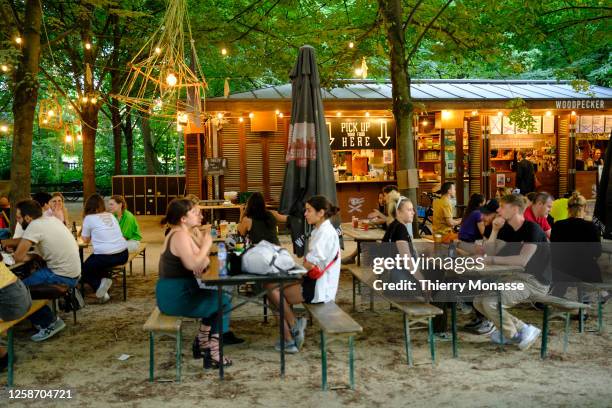 People enjoy a warm evening in early Summer in the Brussels Park on June 14, 2023 in Brussels, Belgium.