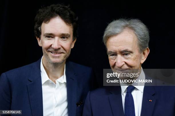 World's top luxury group LVMH head Bernard Arnault and his son, CEO of LVMH Holding Company, Antoine Arnault attend the Vivatech technology startups...