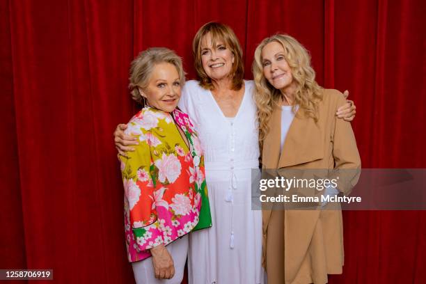 Charlene Tilton, Linda Gray and Joan Van Ark of "DALLAS" pose for a portrait at Oscar's on June 13, 2023 in Palm Springs, California.