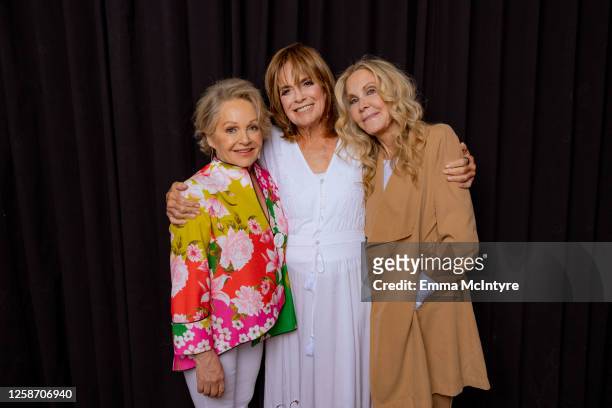Charlene Tilton, Linda Gray and Joan Van Ark of "DALLAS" pose for a portrait at Oscar's on June 13, 2023 in Palm Springs, California.