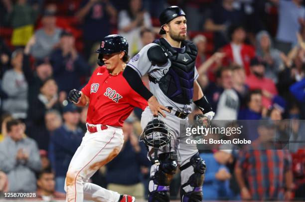 Boston Red Sox CF Jarren Duran scores a run in the seventh inning. The Red Sox beat the Colorado Rockies, 6-3.