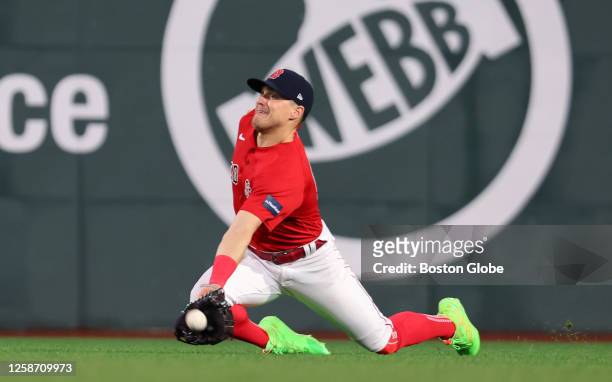 Boston Red Sox CF Kike Hernandez makes a diving catch in the fifth inning. The Red Sox beat the Colorado Rockies, 6-3.