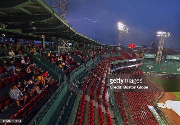 Lightning strikes over Fenway Park. The Red Sox beat the Colorado Rockies, 6-3.