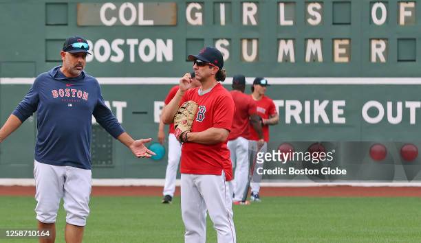 Boston Red Sox manager Alex Cora watches batting practice before the game. The Red Sox beat the Colorado Rockies, 6-3.