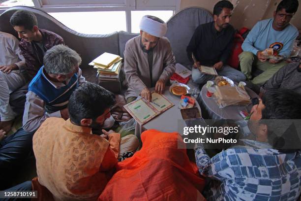 Muslim cleric reads the Islamic marriage contract during the mass marriage ceremony organised by 'We The Helping Hands Foundation' in Srinagar,...