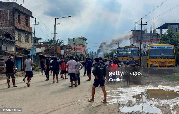 Smoke bellows from a street after a standoff between mob and security forces at Sekhon in Imphal East during ongoing ethnic violence in India's...