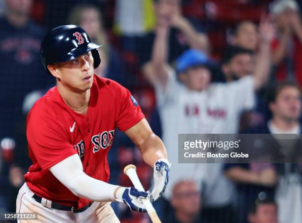 Boston Red Sox LF Rob Refsnyder watches his two-run triple. The Red Sox beat the Colorado Rockies, 6-3.
