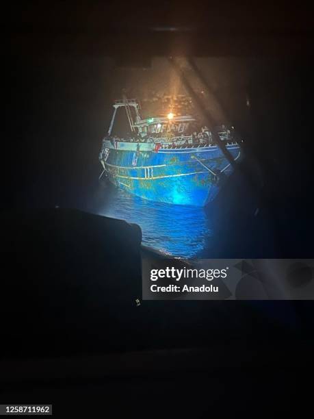 Photo shows the boat carrying migrants before it sank, in Kalamata, Greece on June 15, 2023. Rescued immigrants of a shipwreck after a boat carrying...